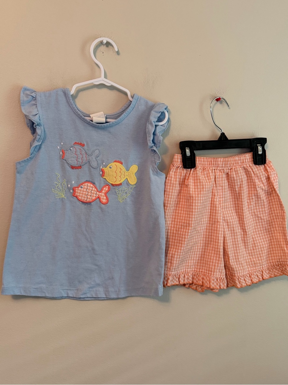 The Bailey Boys Blue Fish Graphic Ruffle Sleeve Top with Peach Gingham Shorts